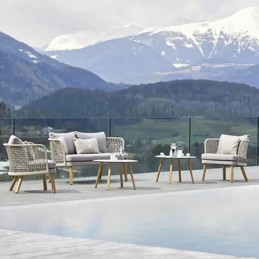 Distinguished Varaschin Emma coffee table with smooth white HPL top and light-toned wooden legs crafted in Italy