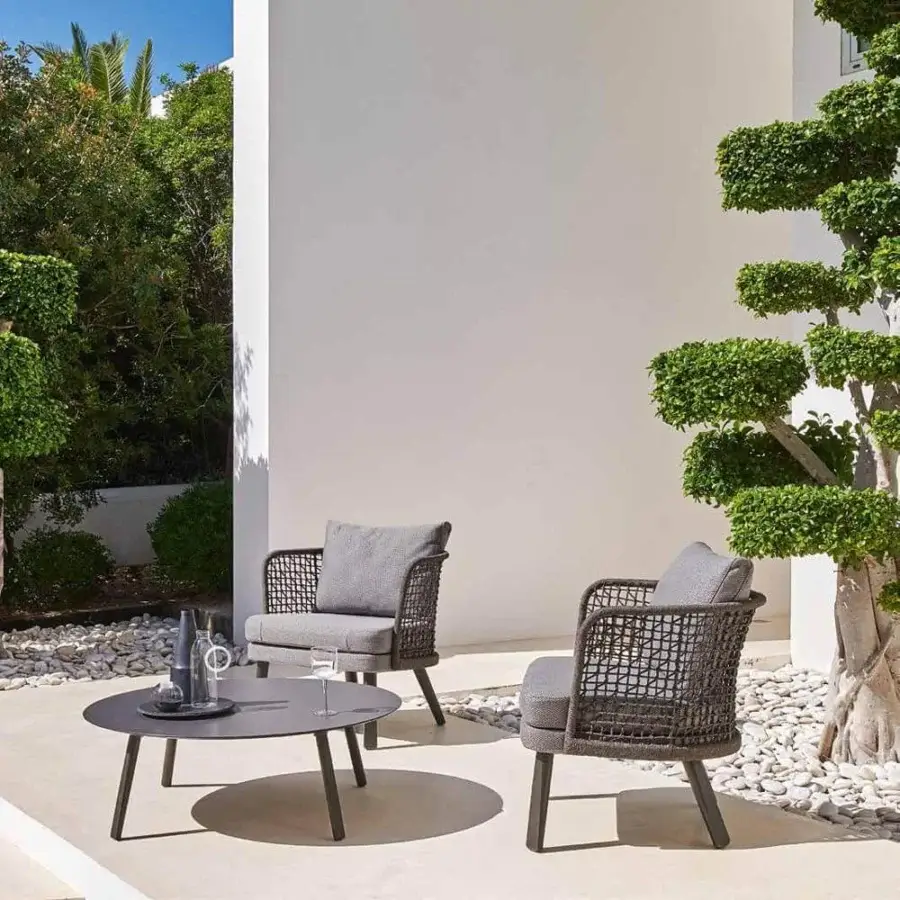 Distinguished Varaschin Emma coffee table with Bush-hammered ceramic top and sleek aluminum legs in a dark gray matte finish