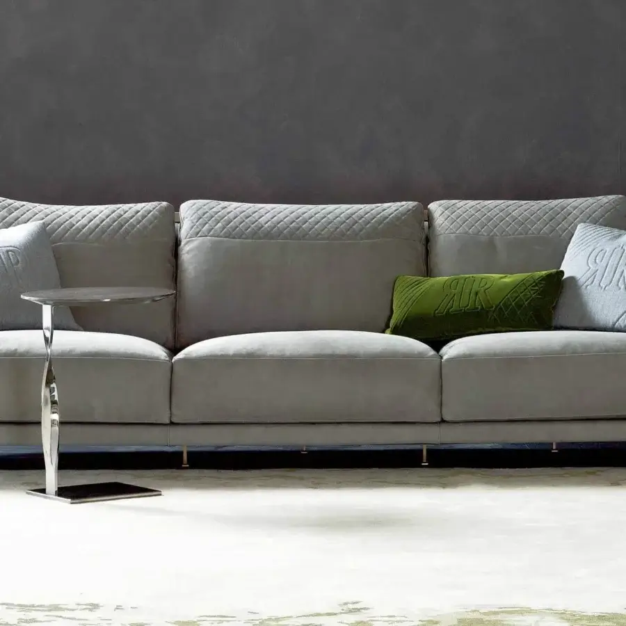 Lavish Rugiano Paris sofa upholstered in gray textile with twisted light gold metal and embossed cushions