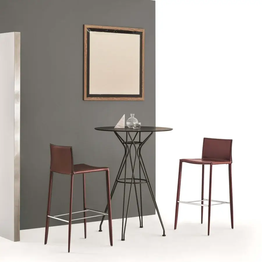 Distinguished Bontempi Linda stool fully upholstered in hide leather with visible stitching and silver metal footrest