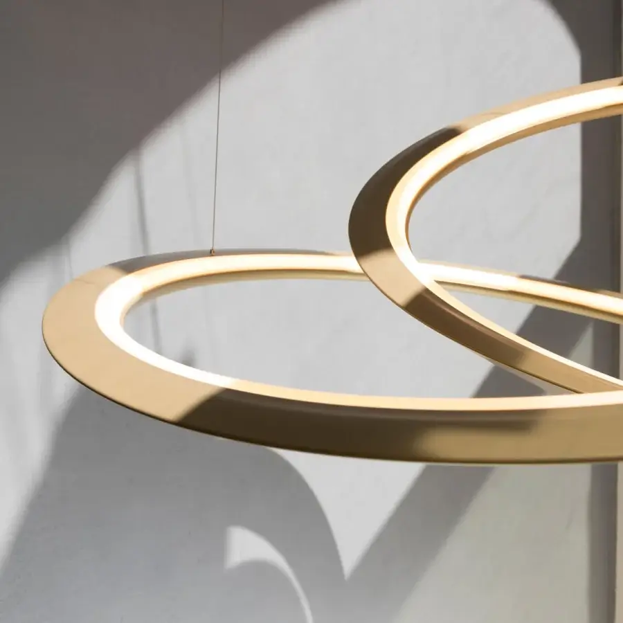 Distinguished Nemo Kepler suspension lamp crafted in painted extruded aluminum with a warm gold finish and interconnected circular forms