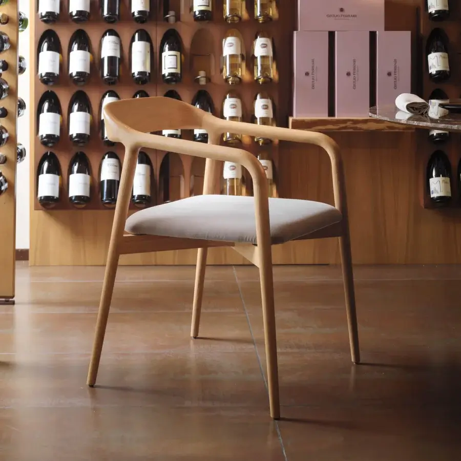 Elegant Horm Velasca armchair crafted in solid ash with a light gray textile seat and smooth matte finish