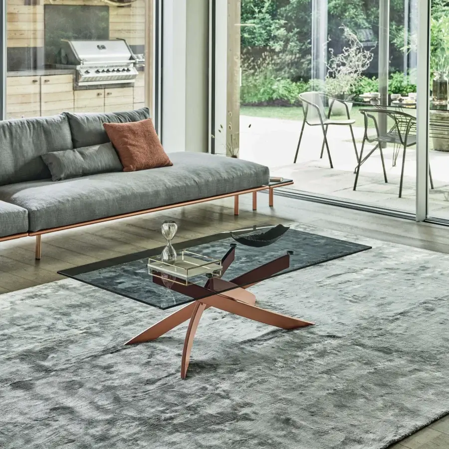 Distinguished Bontempi Artistico coffee table with sculptural radiating metal base and dark tinted glass top