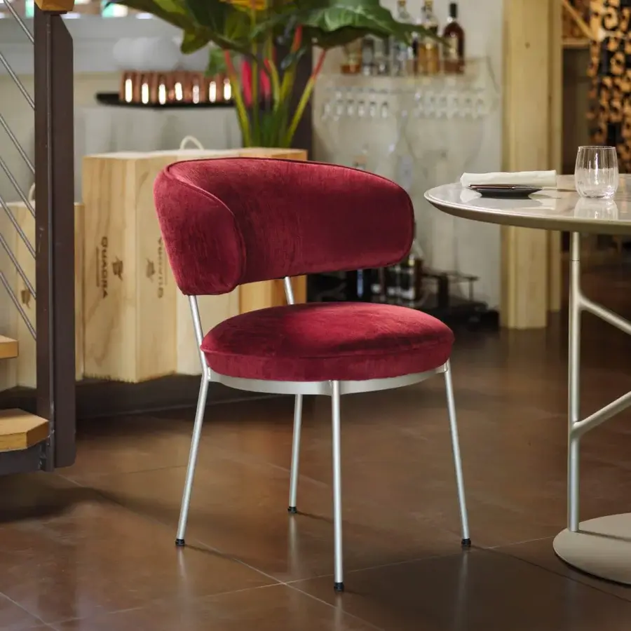 Elegant Horm Vendome armchair with deep red textile upholstery and silver tone metal frame built with curved lines