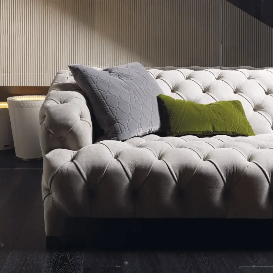 Superior Rugiano Cloud sofa upholstered in light beige fabric with a refined tufted finish and accompanying cushions
