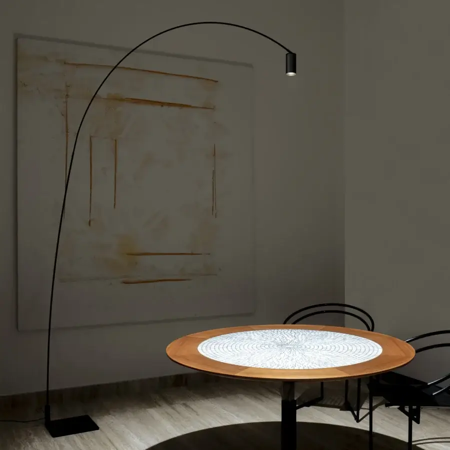 Elegant Nemo Lighting Fox floor lamp with a swiveling arc in matte black painted steel and cylindrical spot head