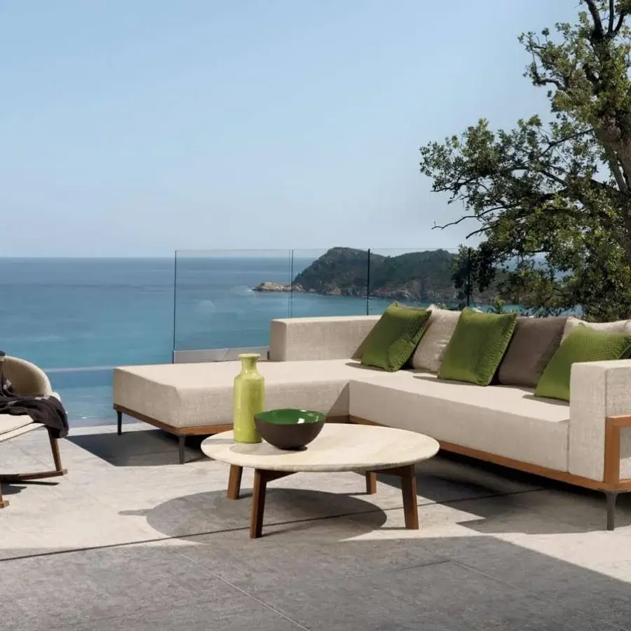 Superior Talenti Cleo sectional with a geometric teak frame and light beige weather-resistant fabric cushions accented with green and brown