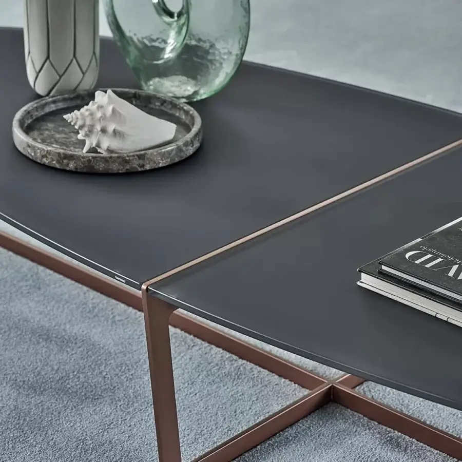 Distinctive Bontempi Cross coffee table with dark gray tabletop and warm copper metal X-shaped base