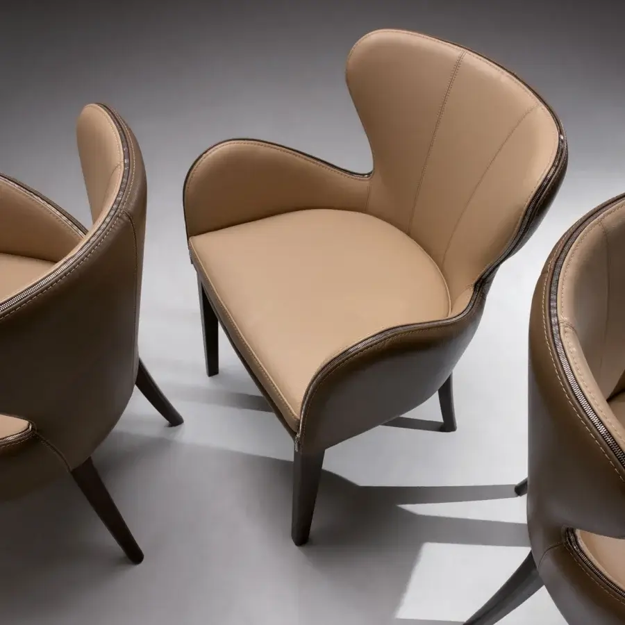 Superior Borzalino Elektra armchair upholstered in light tan leather with dark brown trim and chromed metal details