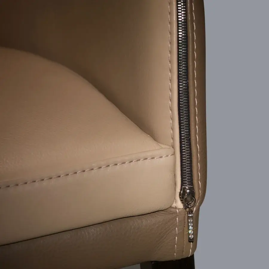 Distinguished Borzalino Elektra armchair upholstered in light beige leather with a chromed metal zipper and crystal pendants
