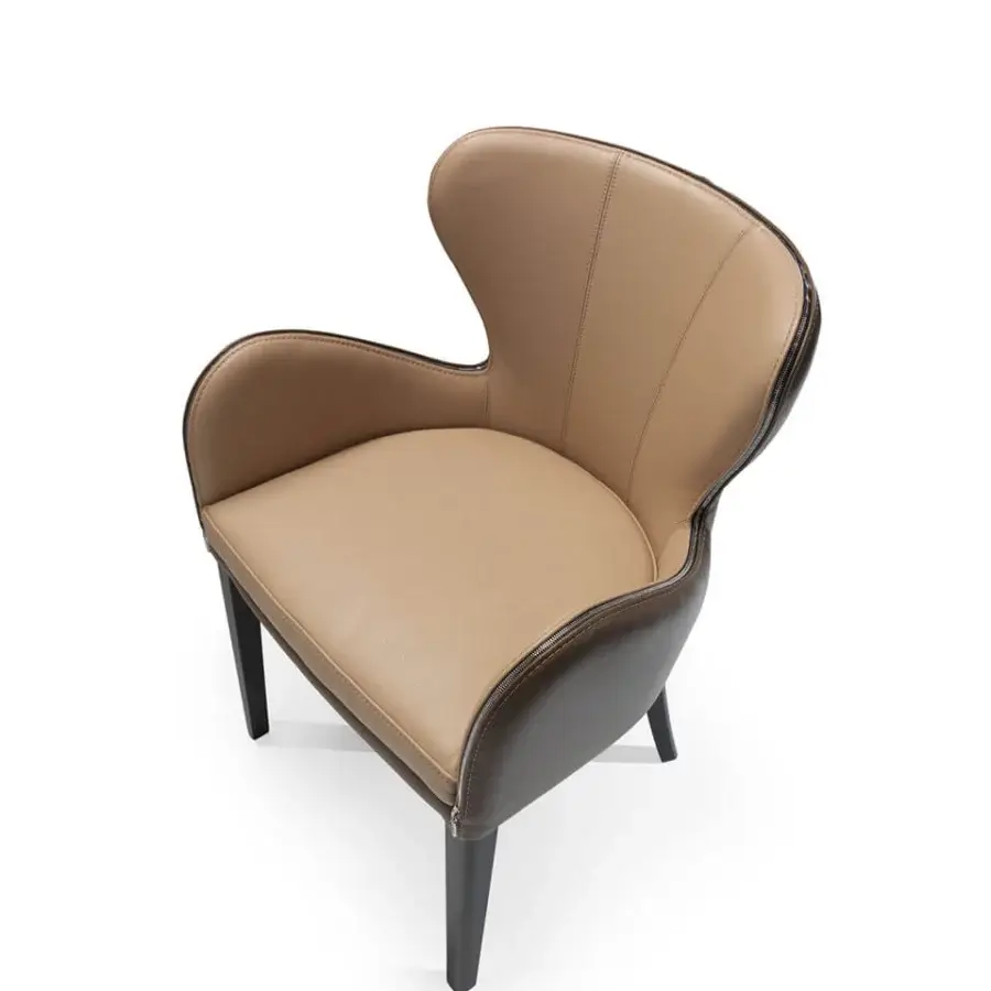 Lavish Borzalino Elektra armchair with sinuous curves upholstered in light tan fabric and dark brown leather with chromed zipper detail