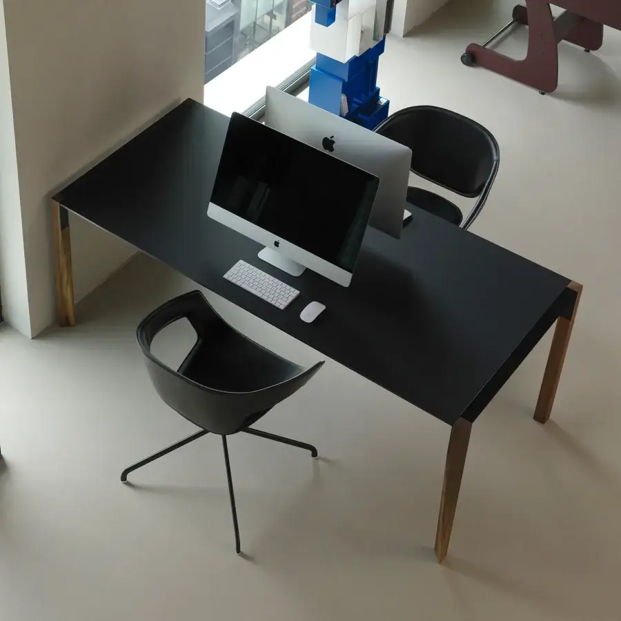 Distinguished Horm Tango table crafted in Italy with a black matte Fenix surface and sinuous wooden legs