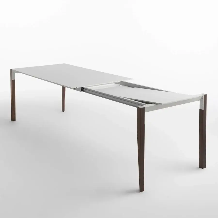 Superior Horm Tango extendable table with a smooth matte white Fenix top and satin finish deep brown wood legs