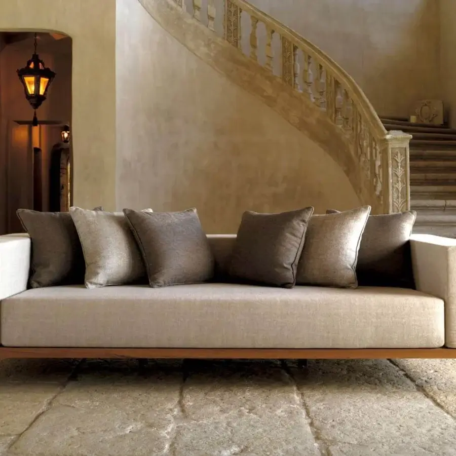 Superior Talenti Cleo sofa with a warm-toned wood structure and light beige fabric cushions accented with grey and brown squares