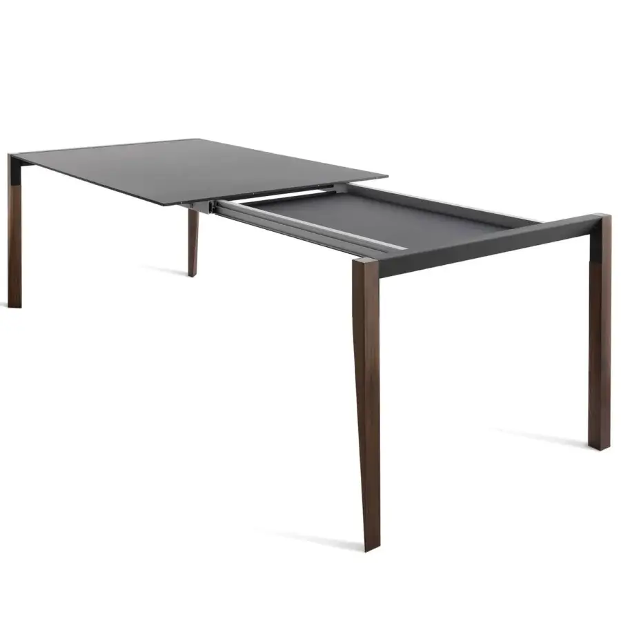 Exceptional Horm Tango extendable table with a dark Fenix tabletop and warm wood legs in a satin finish