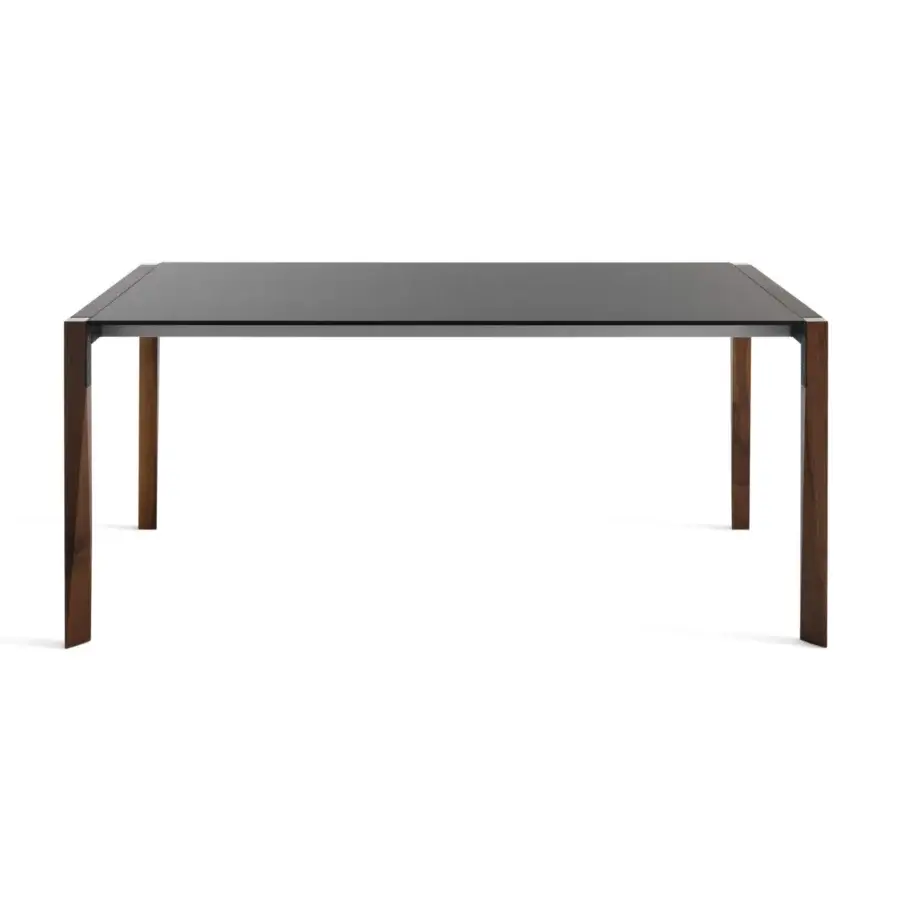 Elegant Horm Tango extendable table with a glossy dark gray Fenix tabletop and sinuous deep brown wood legs