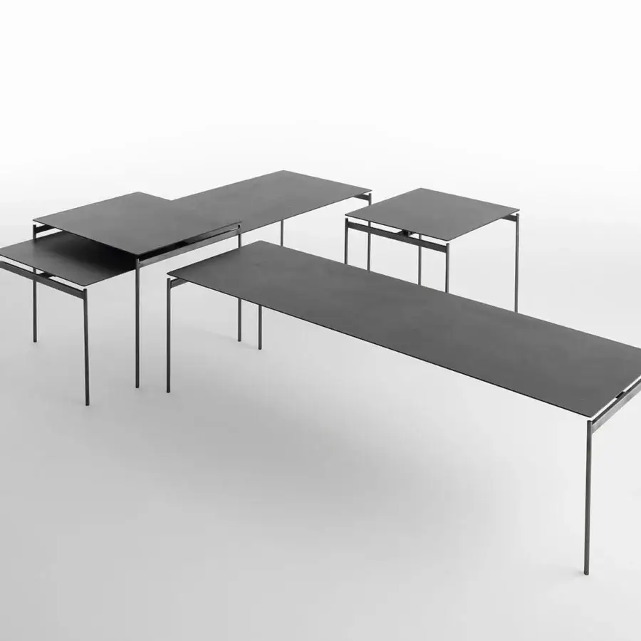 Distinguished Horm Torii coffee table with a dark matte gray ceramic tabletop and unvarnished hard metal legs crafted in Italy