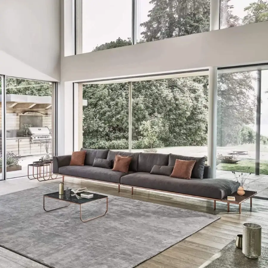 Elegant Bontempi Tokio coffee table with a curved copper tone metal frame and transparent tabletop crafted in Italy