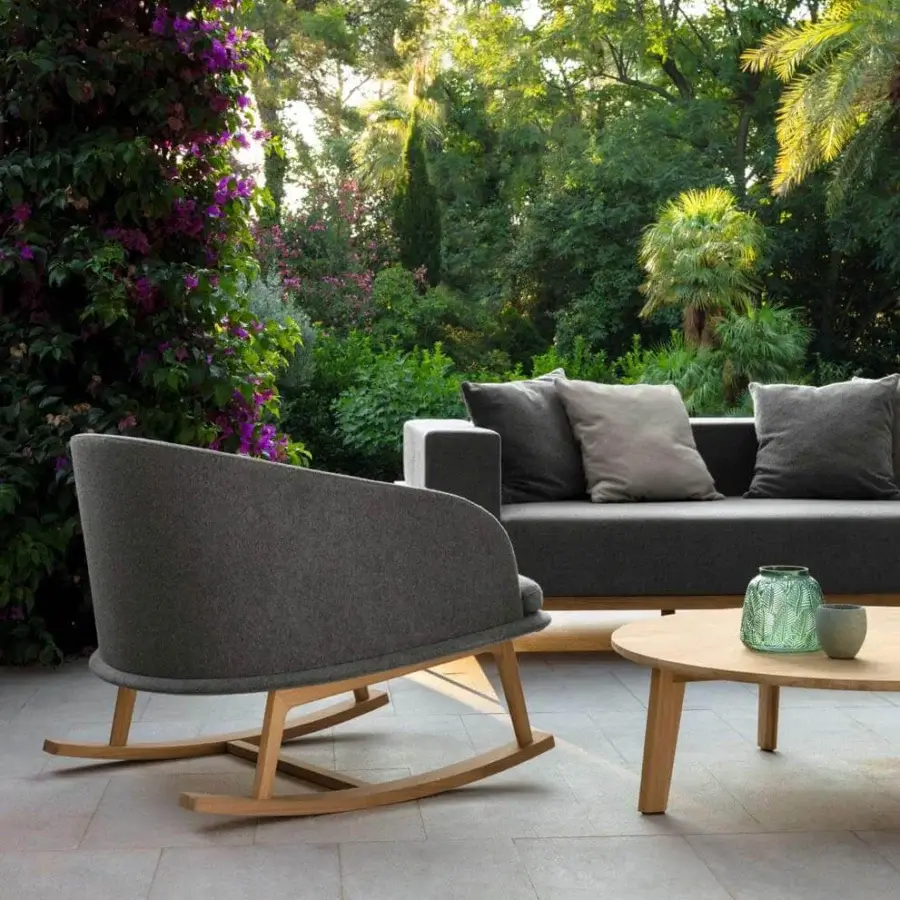 Distinguished Talenti Cleo rocking lounge chair with refined removable cushions upholstered in uniform gray weather-resistant fabric and light natural wood