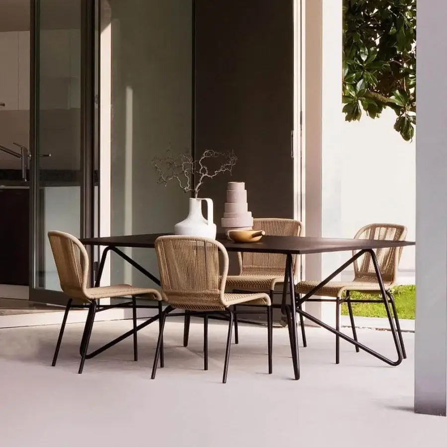 Exceptional Varaschin Cricket chair with hand-woven seat and backrest crafted from natural-looking synthetic fiber in light beige with a dark matte finish
