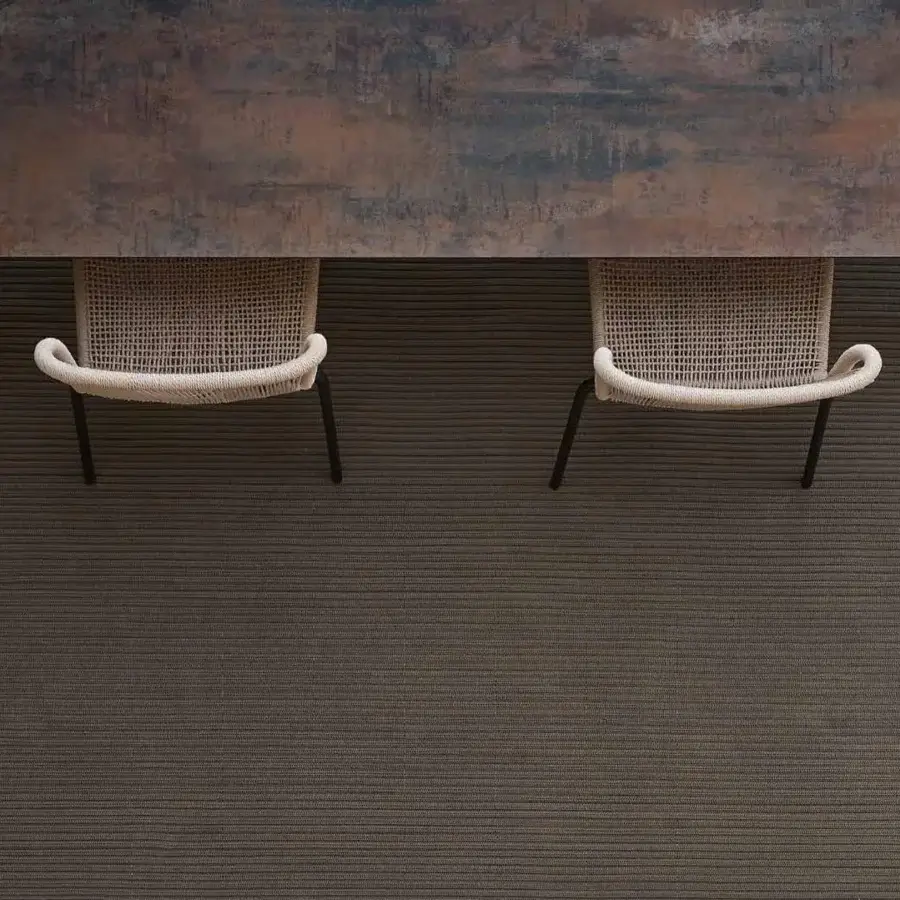 Distinguished Varaschin Cricket chair with a powder-coated aluminum structure and light-colored hand-woven synthetic fiber covering