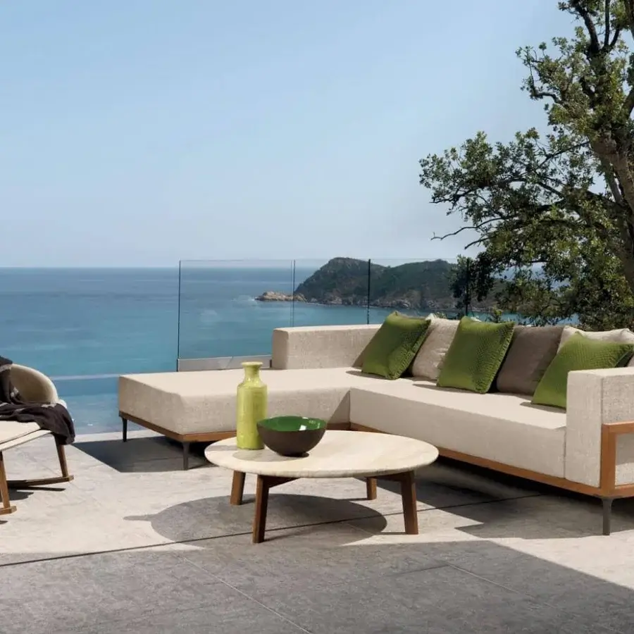 Distinguished Talenti Cleo coffee table with natural stone patterns and angled teak wood legs crafted in Italy