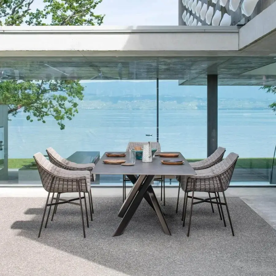 Distinguished Varaschin Summer Set armchair with a powder-coated steel grid frame and woven light grey textile seat and back