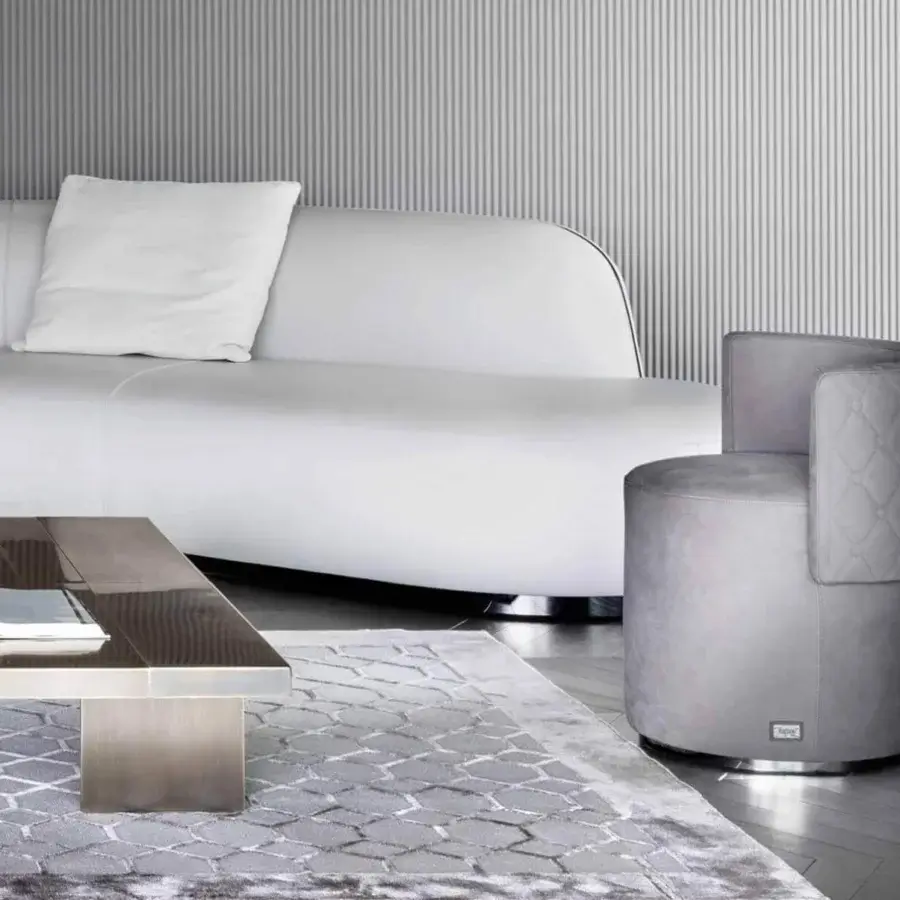 Exceptional Rugiano Love Seat ottoman upholstered in grey textile with quilted curved back and silver-toned metal base