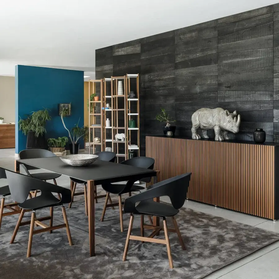 Exceptional Horm Leon sideboard with a sleek low profile built in wood with a medium brown slatted pattern and contrasting black matte top