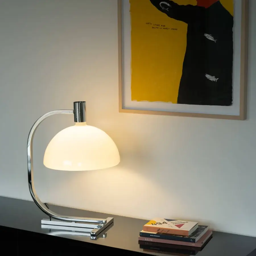 Elegant Nemo Lighting AS1C lamp with curved geometric silhouette and glossy metal built with hand-blown glass diffuser