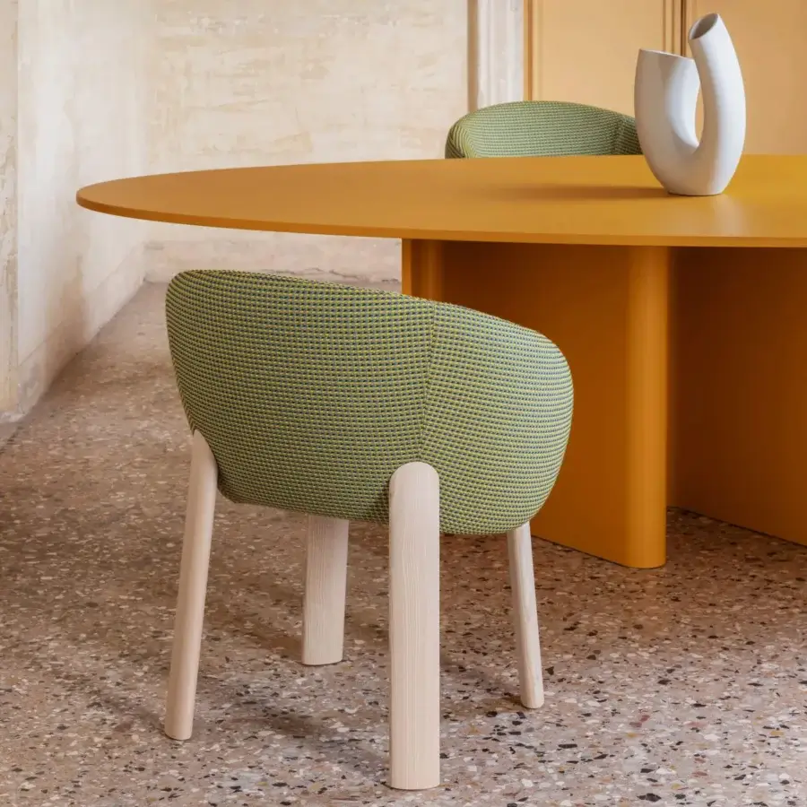 Distinguished Miniforms Nami table with sinuous bent wood base supporting a round top in matte mustard yellow