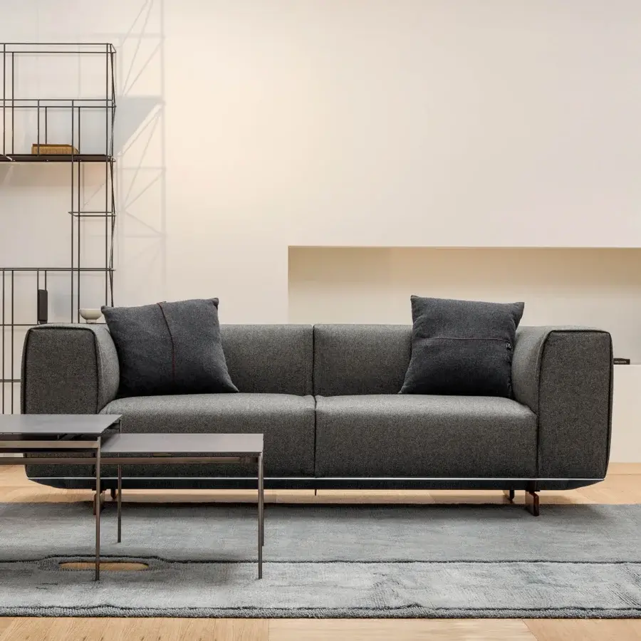 Sophisticated Horm Coleman sofa with dark gray textile upholstery and distinctive aluminum frame built with solid canaletto walnut feet
