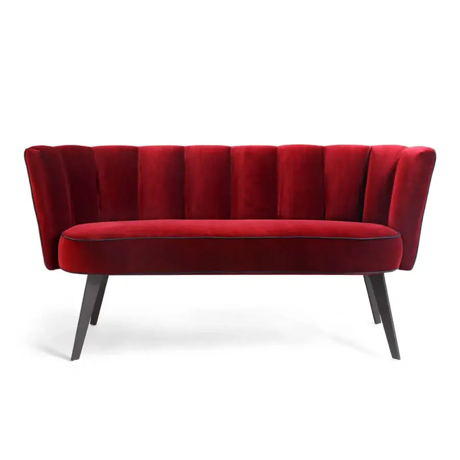 Exclusive Borzalino Diva sofa with shell silhouette upholstered in sumptuous red velvet and lacquered metal base