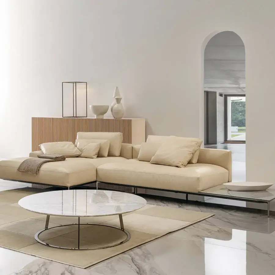 Elegant Horm Dizzy sectional with light beige smooth upholstery and dark metal frame, built with modular components