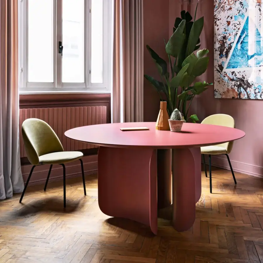 Distinctive Miniforms Barry table with reddish-pink volumes and curled legs crafted in a smooth matte material