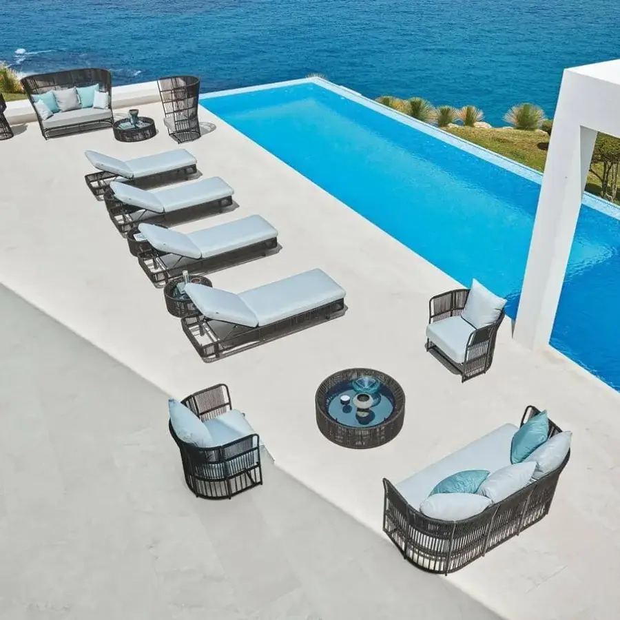 Lavish Varaschin Tibidabo lounge chair with Silk Grey structure and Perla Rope weaving in light blue cushions