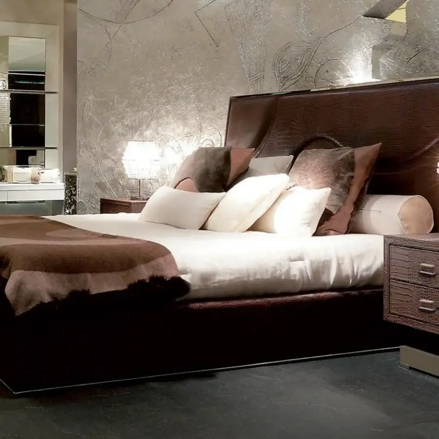 Exceptional Rugiano Riflesso bed with dark brown crocodile-like finish and wave-form stitching on expansive headboard crafted in metal