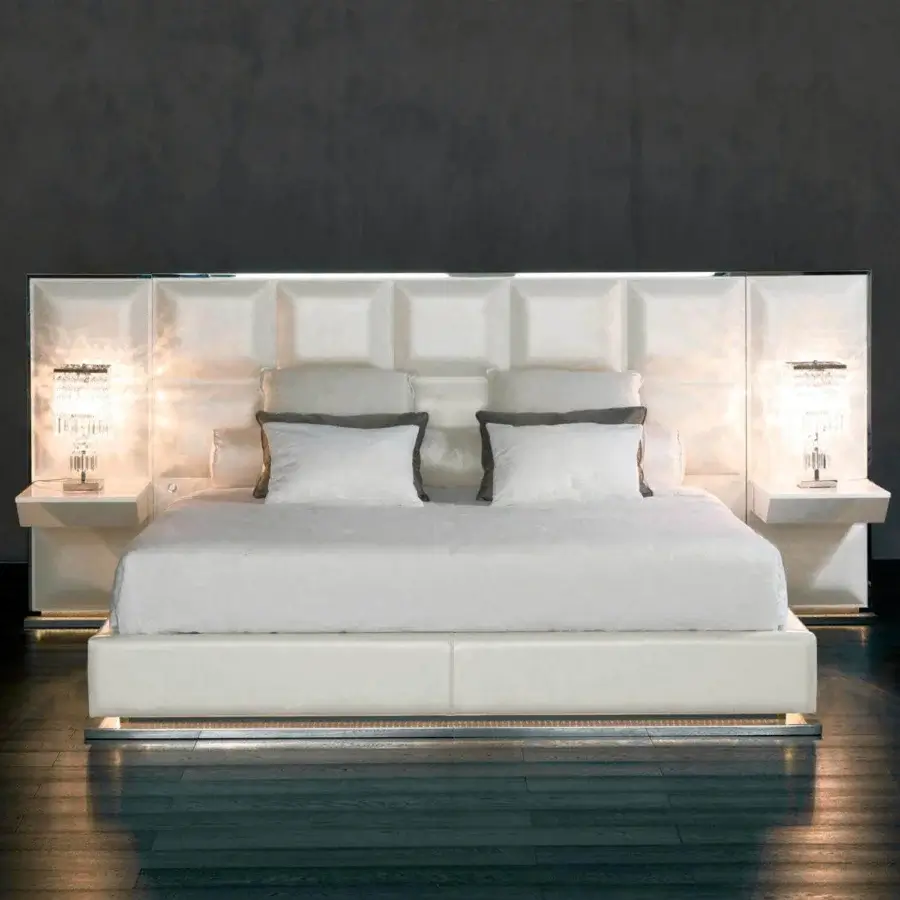 Elegant Rugiano Gemma bed with a padded square headboard and integrated nightstands in white textile or synthetic leather with bronze or steel finish