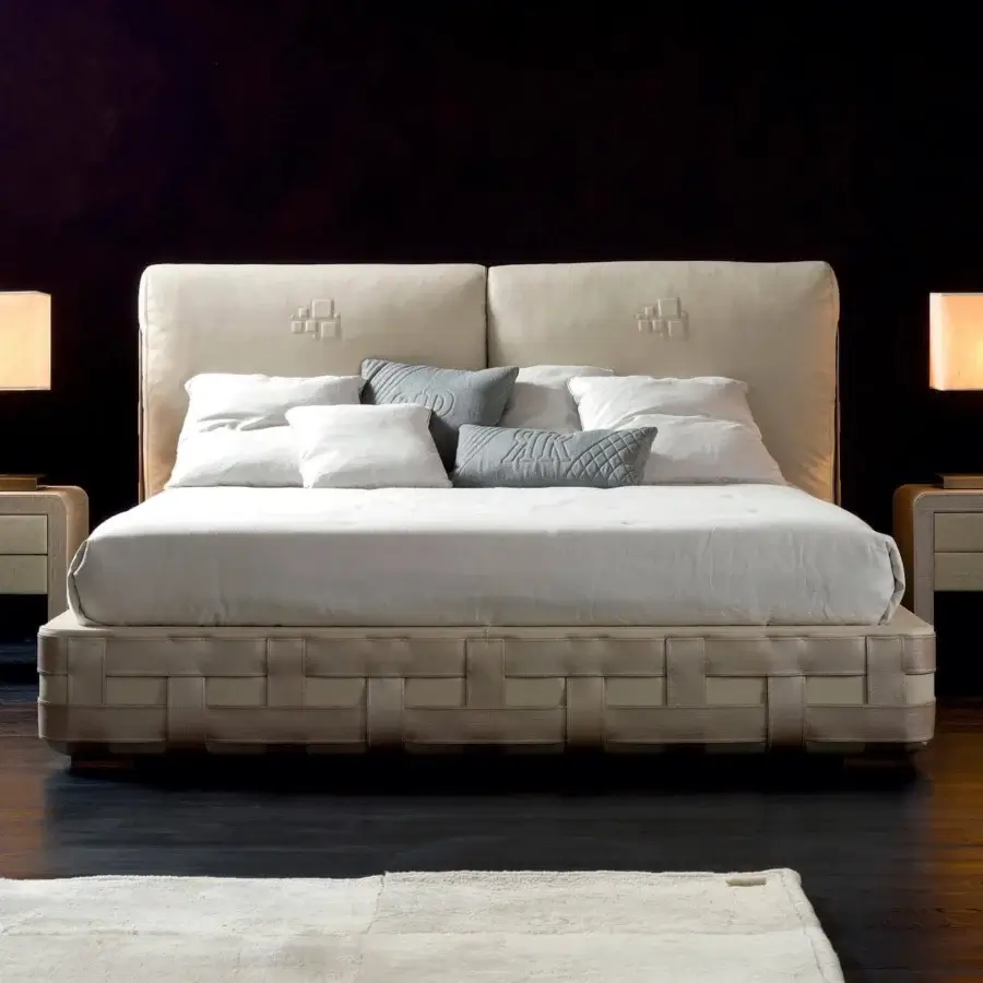 Sophisticated Rugiano Braid bed with light beige textile and steel accents displaying a braid decoration in matching technobuk