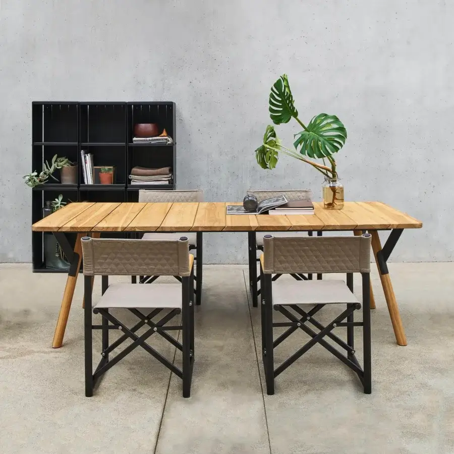 Distinguished Varaschin Link table with warm teak wood and a powder-coated aluminum frame built with sleek black metal hardware