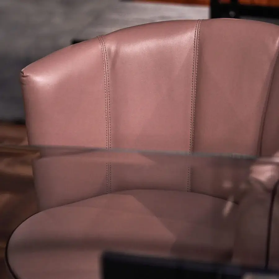 Distinguished Borzalino Diva chair in muted rose synthetic leather with a smooth matte finish and segmented vertical seams