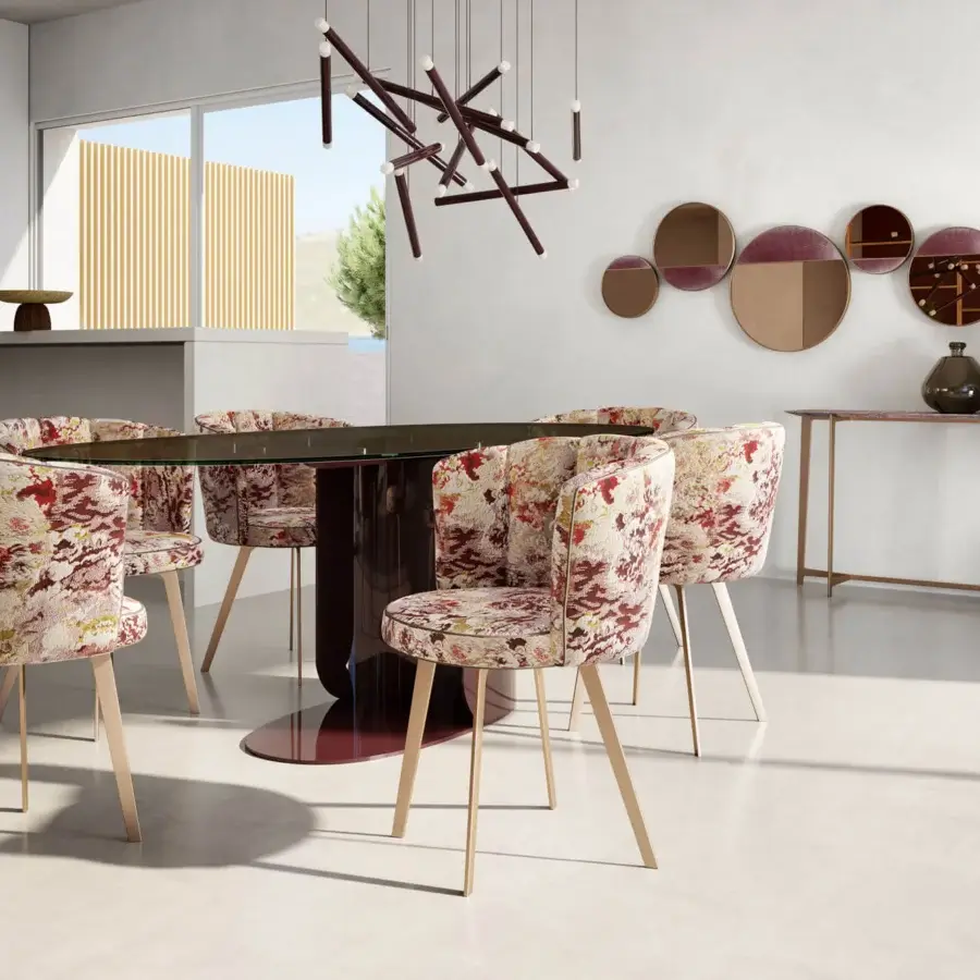 Distinguished Borzalino Diva chair with a shell silhouette upholstered in red, beige, and white floral textile and lacquered metal base