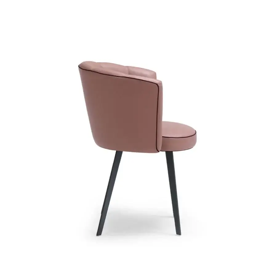 Elegant Borzalino Diva chair with shell silhouette upholstered in pink synthetic fabric and black piping with lacquered black metal base