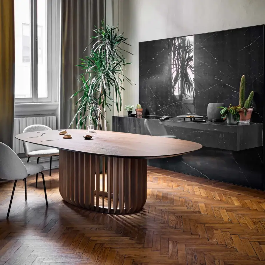 Elegant Miniforms Juice table with veneered wood top and Flamed Oak base built with lighter-toned vertical slats creating balanced spaces