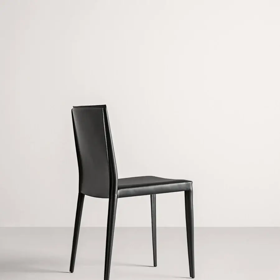 Elegant Frag Lilly chair with sleek black Leather upholstery exhibits angular design and ornate rear seams