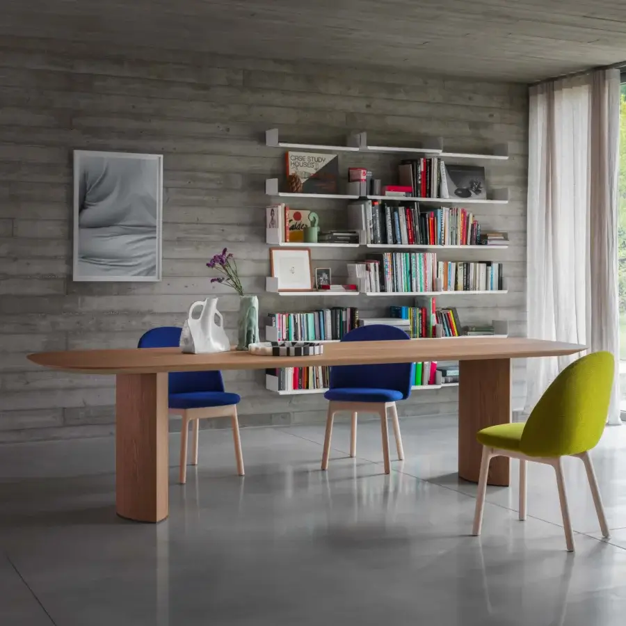Elegant Miniforms Plauto table crafted in Italy with a light wood oval top and thick rectangular wood pillars