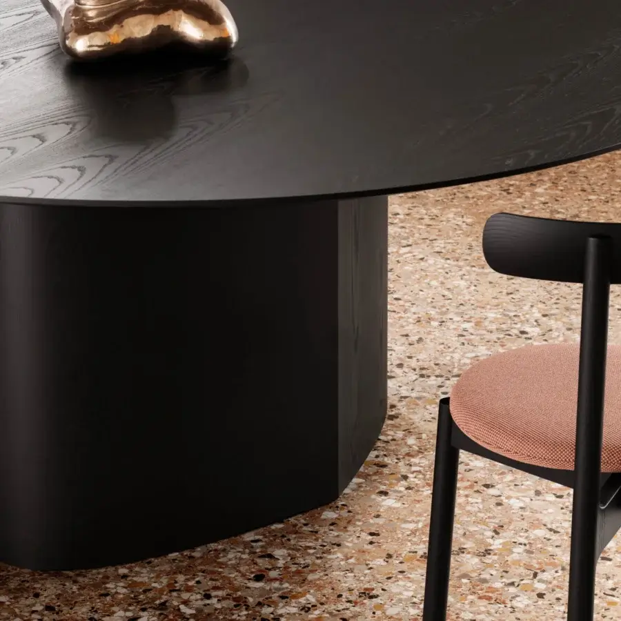 Superior Miniforms Monoplauto table with a leaf-shaped leg and matte black finish displaying visible wood grain
