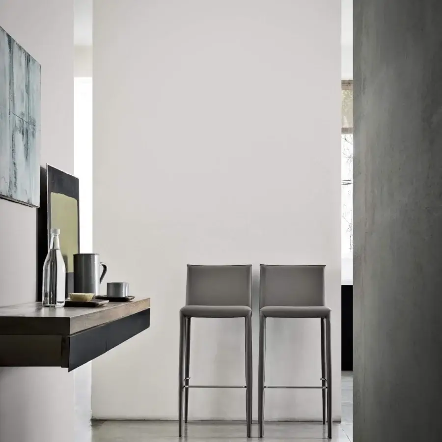 Distinguished Frag Lilly stool upholstered in leather or saddle leather with slender metal legs and smooth gray finish