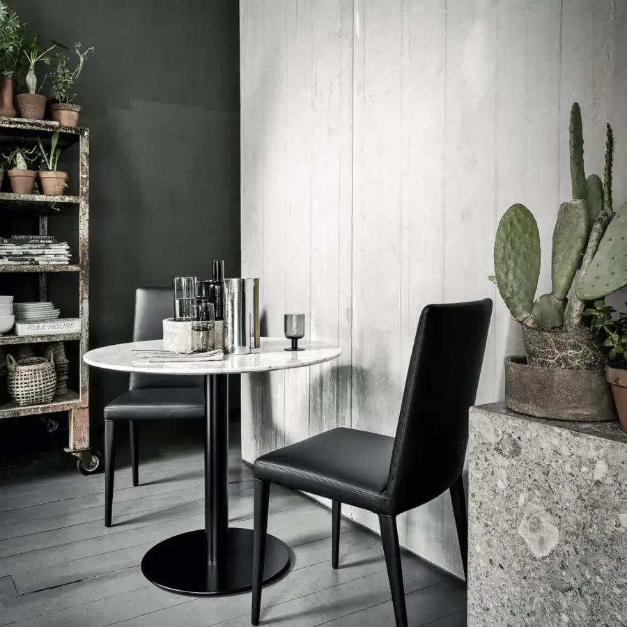 Exceptional Frag Bella chair handcrafted in Italy with black leather-like material and matte black metal frame
