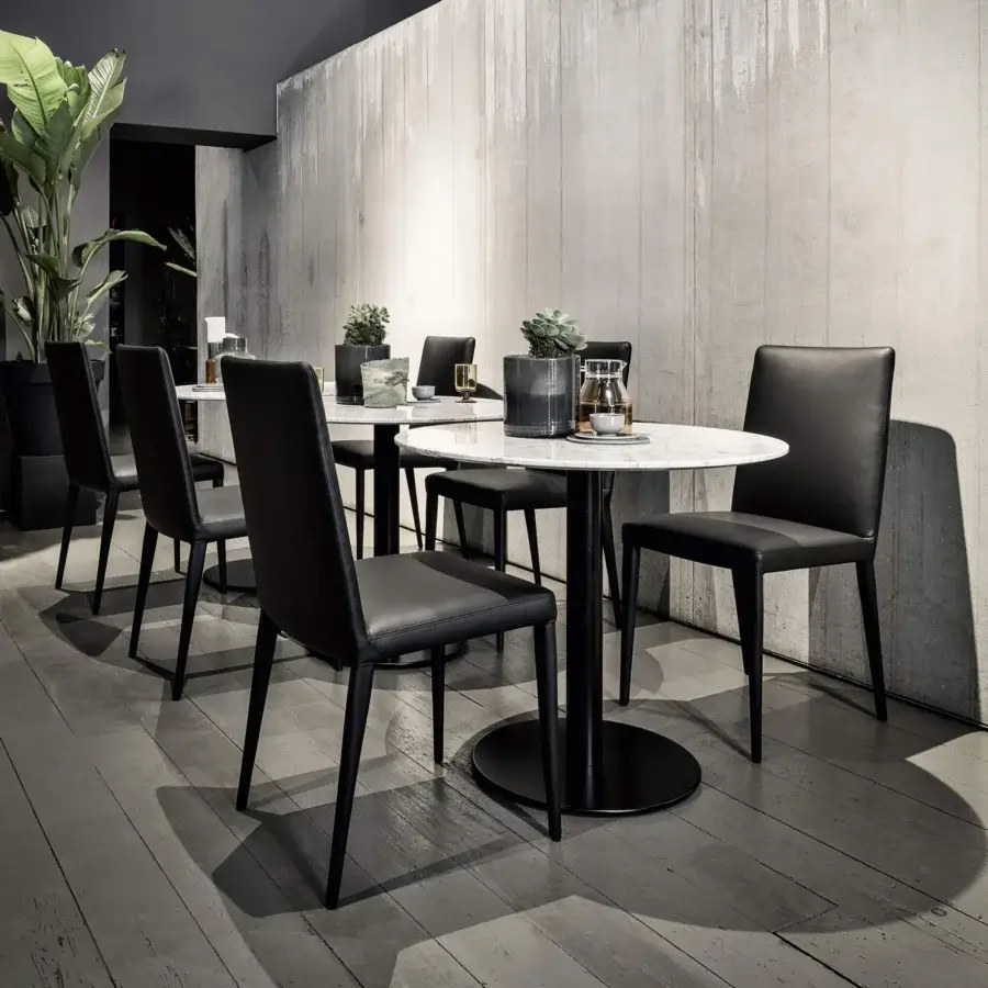 Distinguished Frag Bella chair with black textile upholstery and slender black metal legs built with innovative flexible spring steel